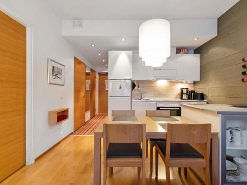 a kitchen and dining room with a table and chairs at Holiday Home Ski chalet vii 7406 by Interhome in Ylläs