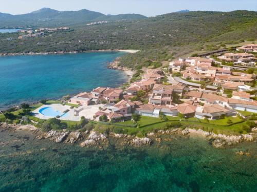 an aerial view of a house on a hill next to the water at Apartment Eucalipto by Interhome in Casa Tamponi