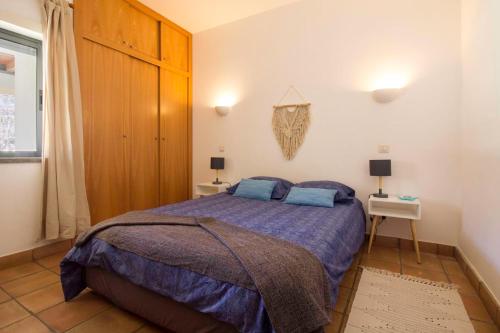 Katil atau katil-katil dalam bilik di Vila Alegria Apartment