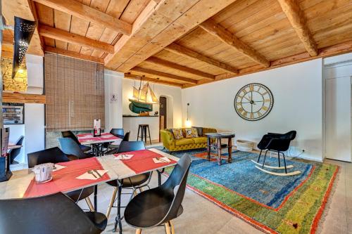 a living room with a table and chairs at Contact Hôtel Le Provence in Gémenos