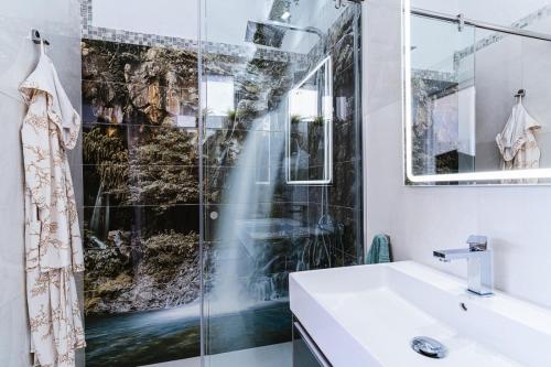 a bathroom with a shower and a sink at 1001 Ocean view house - Puerto Rico in Mogán