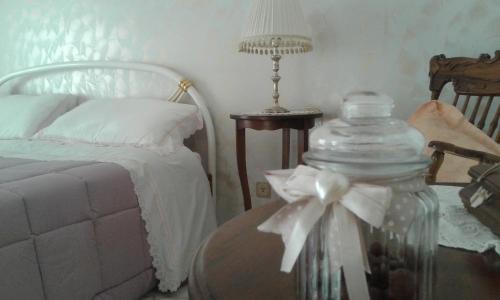 מיטה או מיטות בחדר ב-Casa Maddalena family
