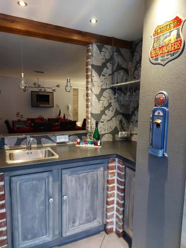 a kitchen with a sink and a counter top at L'Éphém'Heer in Hastière-par-delà