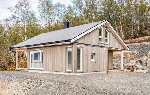 a small house with a roof on a lot at Stunning Home In Gjemnes With Wifi in Stokke