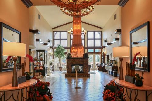 a lobby with a fireplace and a chandelier at RiverStone Resort & Spa in Pigeon Forge