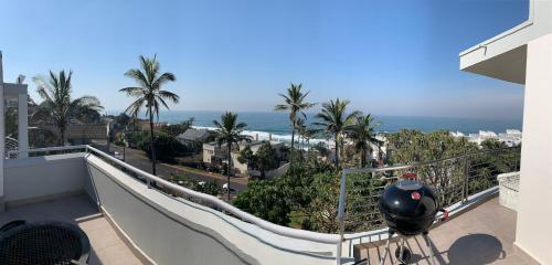 a balcony with a view of the ocean at Chakas Cove in Ballito