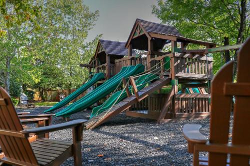 a group of playground equipment with a slide at RiverStone Resort & Spa in Pigeon Forge