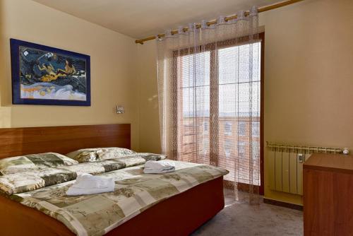 Posteľ alebo postele v izbe v ubytovaní Tatragolf Mountain Resort