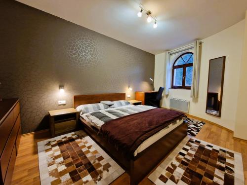 Un pat sau paturi într-o cameră la Dream Apartments No.202 - Right in the heart of Tále