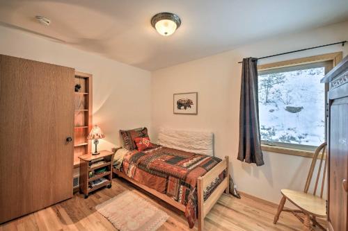a bedroom with a bed and a window at Montana Home on 5 Acres Near Lake Koocanusa! in Rexford
