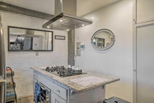 a kitchen with a stove and a mirror at Pet-Friendly El Paso Escape with Patio and Grill! in El Paso