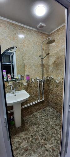 a bathroom with a shower and a sink at G&S Guest House in Gyumri