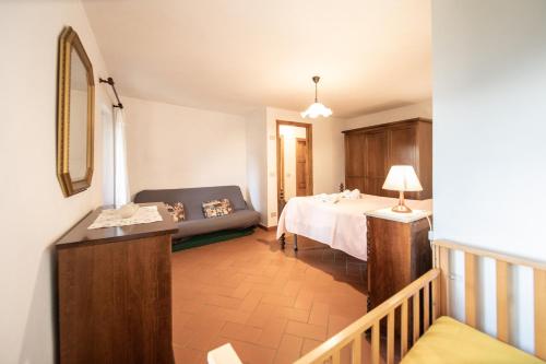 Cama o camas de una habitación en Casetta di Butia, Mimosa Apartment
