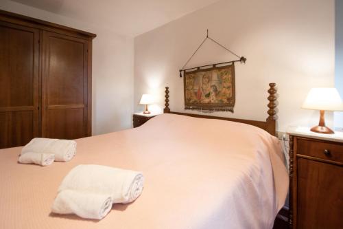 Cama o camas de una habitación en Casetta di Butia, Mimosa Apartment