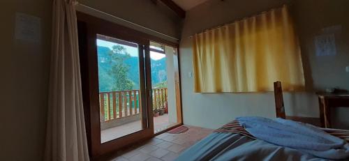 a bedroom with a bed and a window with a view at Gocta Miradors Deluxe in Cocachimba