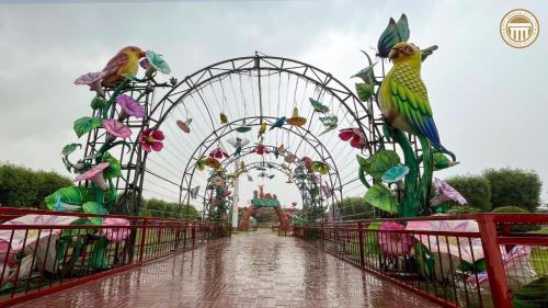 a carnival ride with a roller coaster at Premier Heights Jhelum in Jhelum
