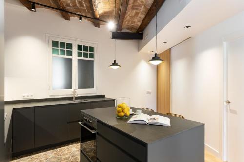 Kuchyň nebo kuchyňský kout v ubytování Enjoy Apartments La Riera One