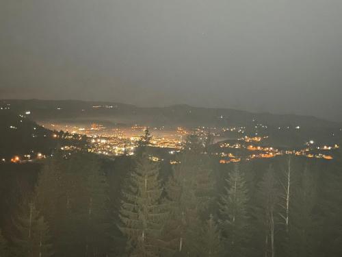 a view of a city at night with lights at Planinska Kraljica in Gornje Pale
