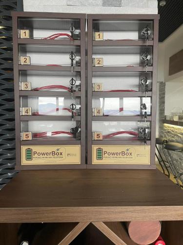 a cabinet filled with boxes filled with red wires at Planinska Kraljica in Gornje Pale
