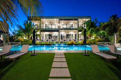 an exterior view of a house with a swimming pool at Black Urchin Boutique Resort in Belford Estates