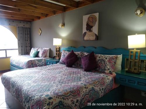 Ein Bett oder Betten in einem Zimmer der Unterkunft MISION SANTA ISABEL