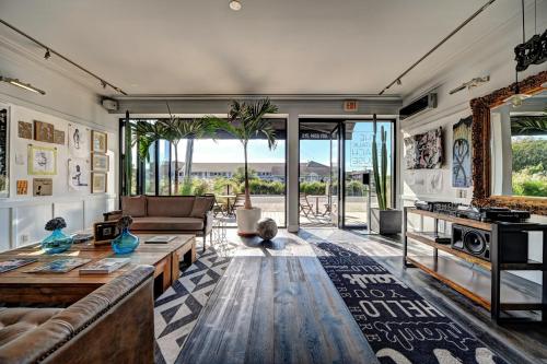 a living room with a couch and a table at The Montauk Beach House in Montauk