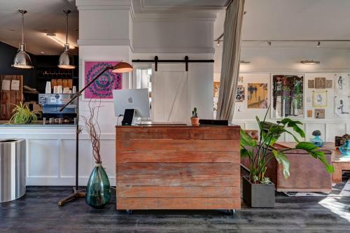 a shop with a counter with plants in a room at The Montauk Beach House in Montauk
