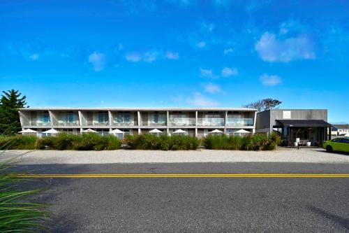 a building with a car parked in front of it at The Montauk Beach House in Montauk