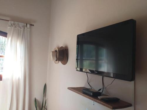 a flat screen tv hanging on a wall at Casona Inkill Huasi II in Tilcara