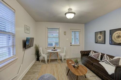 a living room with a couch and a table at Gated Retreat Steps from Midtown's Best Parking in Memphis