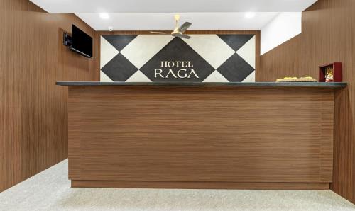 a hotel lobby with a hotelraapa sign on the wall at Treebo Trend Raga in Visakhapatnam