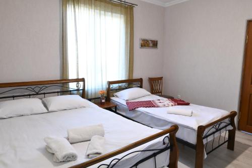 Postel nebo postele na pokoji v ubytování Marcos Hotel