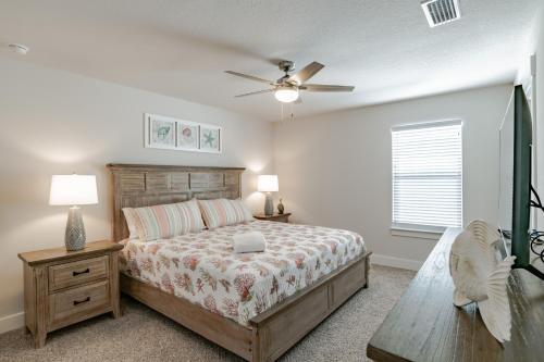 a bedroom with a bed and a ceiling fan at Serenity Island Treasure At 7868 Evening Glow Drive in Pensacola