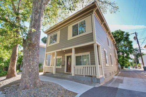 a house with a tree in front of it at Historic Charm with Parking in Center of Midtown in Sacramento