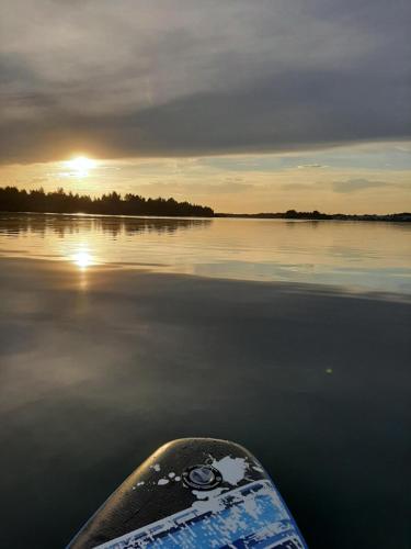 a view from the end of a boat on a lake at Leipziger Neuseenland Apartment in Markkleeberg