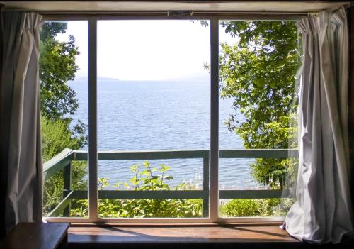 a window view of the ocean from a house at Bocalago in Puerto Nuevo