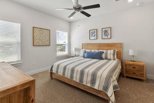 a bedroom with a bed and a ceiling fan at Serenity Salty Intentions At 14334 Gardenglen Drive in Pensacola