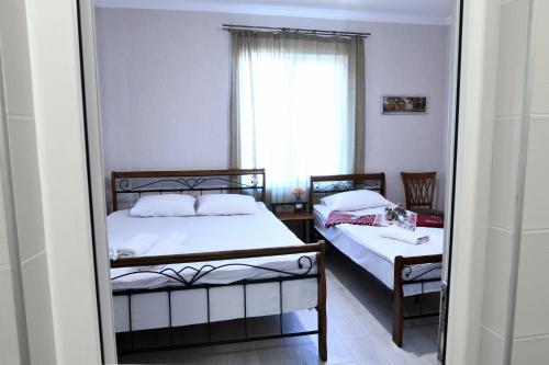 Postel nebo postele na pokoji v ubytování Marcos Hotel