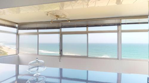 a large window with a view of the ocean at Shangri-La Penthouse View in Kingsburgh