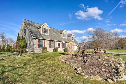 a house with a garden in the yard at Spacious Home Near Bromley Mountain Ski Resort! in Manchester Center