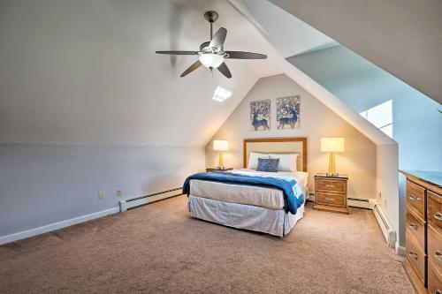 a bedroom with a bed and a ceiling fan at Spacious Home Near Bromley Mountain Ski Resort! in Manchester Center