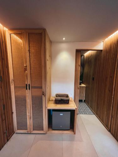 a room with wooden walls and a table in a room at Hawkay Glamping in San Miguel de Salcedo