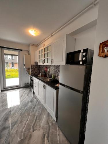 Кухня или мини-кухня в Libertatii Gardens Residences
