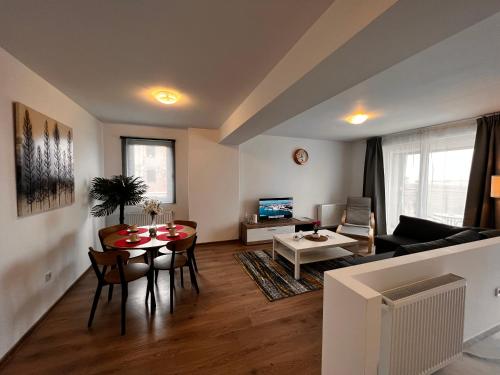 Телевизор и/или развлекательный центр в Libertatii Gardens Residences