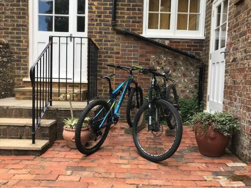 two bikes parked in front of a house at Walkers Rest! in Alfriston