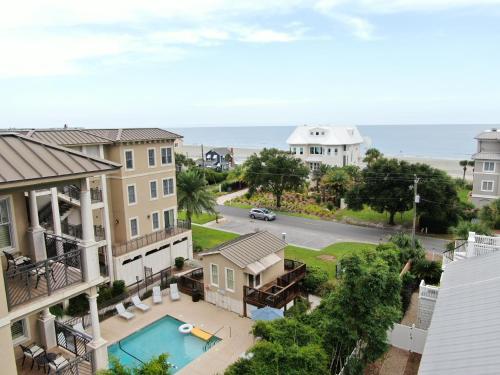 a view from the balcony of a house with a pool at Sea Gate Inn in Saint Simons Island