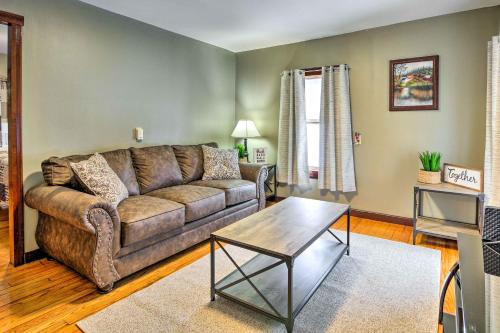 a living room with a couch and a table at Hilltop Home with Grill, In Wayne Natl Forest in Logan