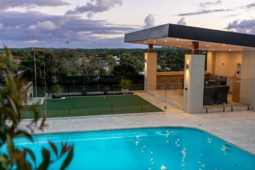 a house with a swimming pool on a roof at OASIS ON SUNSET - tranquility close to the ocean in Ocean Grove