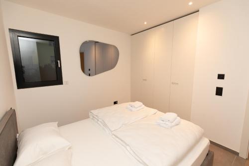 Postel nebo postele na pokoji v ubytování Residenza 3544