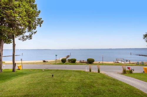 a road leading down to a beach with a playground at The Ship's Bridge in Annapolis